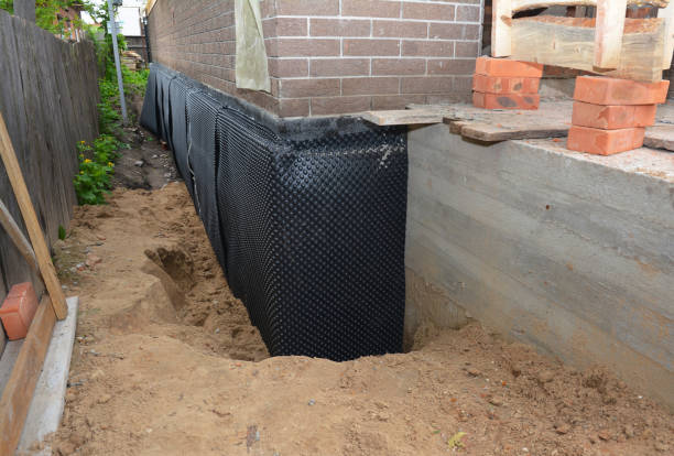 SJ Waterproofing Pros technician performing targeted Emergency Waterproofing assessment in Twelve Mile, IN